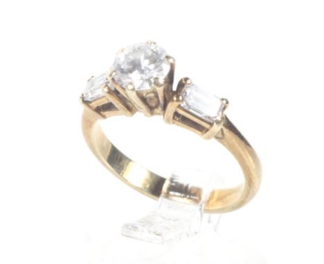 A vintage gold and diamond solitaire ring with diamond shoulders. The central round brilliant approx. 0.55cts, between emeral