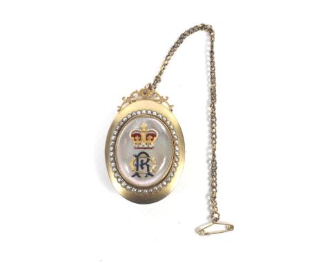 An early 20th century gold, half-pearl and reverse crystal intaglio oval pendant with a Royal monogram GR. The mother-of-pear