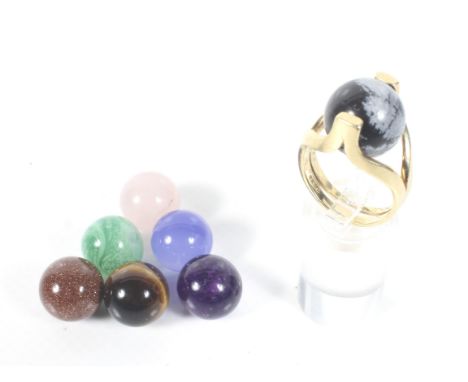 A vintage 18ct gold and multi-gem interchangeable beads ring. The two-row shank and head open to accommodate the beads, hallm