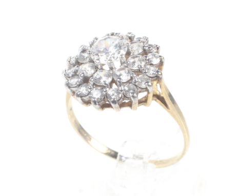 A vintage 9ct gold and cubic zirconia cluster ring. Int the form od a three-tier cluster, on a D-section shank with hallmarks