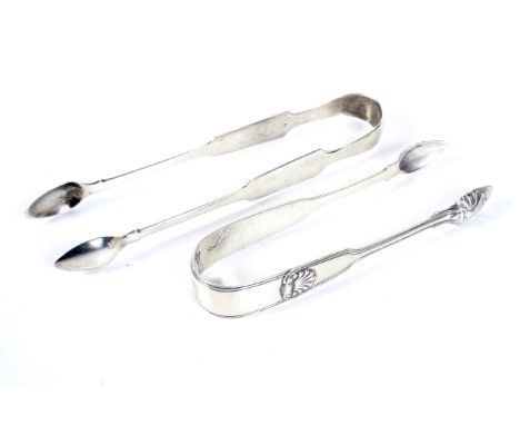 Two George III silver sugar tongs. Comprising; a fiddle, thread and shell example, engraved with a crest, maker's mark of Pau