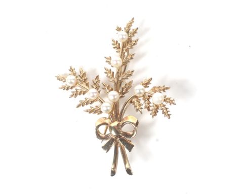 A vintage 9ct gold and small cultured-pearl ribbon-tied spray brooch. In the form of three twin-leaf stems set with a total o