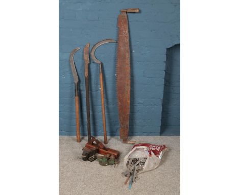 A collection of vintage tools, to include Sorby plane, vice, scythe and bag of spanners.  