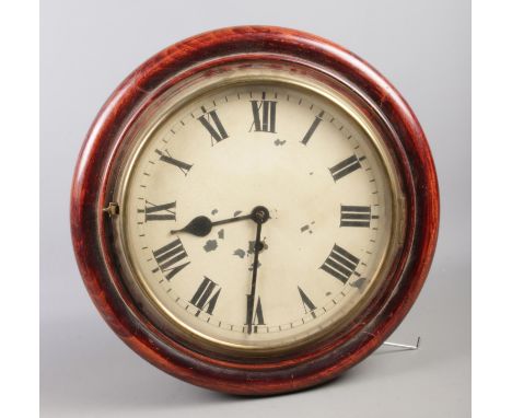 A Mahogany cased wall clock. Comprising of enamel dial and roman numerals. D: 28cm  Missing key and pendulum. Will need some 