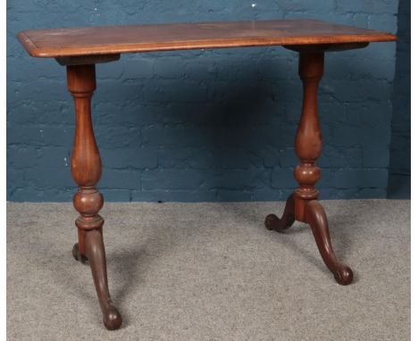 A Victorian mahogany console table, with turned legs supporting scrolled feet. Height: 72cm, Width: 99cm, Depth: 50cm.  Woodw