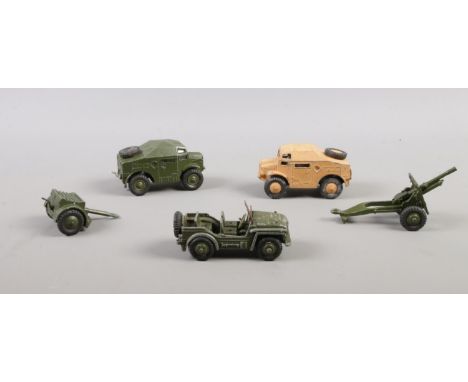 A collection of Dinky die cast vehicles. To include field artillery tractor 688, Austin Champ 674 etc  