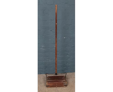 A vintage wooden The Ensign carpet cleaner.  