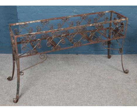 A wrought iron rectangular planter. With scrolled decoration. (67cm x 130cm)  