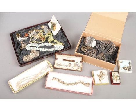 A collection of vintage costume jewellery. To include brooches, necklaces, belt buckles etc  