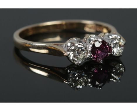 A 9ct Gold Ruby and Diamond three stone ring. Size O. Total weight: 2.25g.  