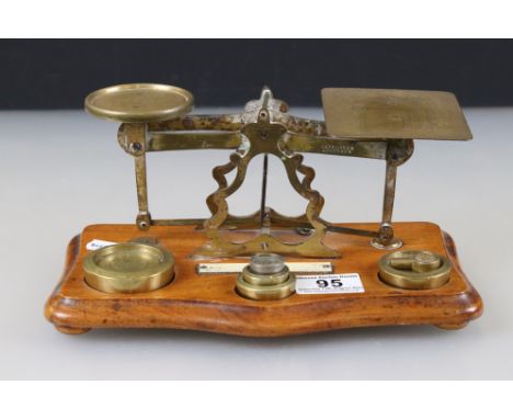 Set of Victorian Brass Postal Scales with Six Weights on a Wooden Plinth Base, 25cm long 