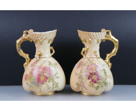 Pair of Royal Worcester Blush Ivory Jugs, decorated with flowers and with gilt moulded handles in the form of branches, patte