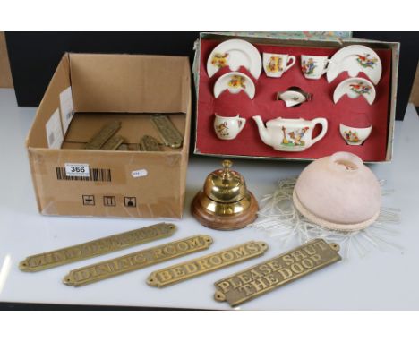 A box of mixed collectables to include brass door signs, lamp shade, desk bell and dolls ceramic tea set. 