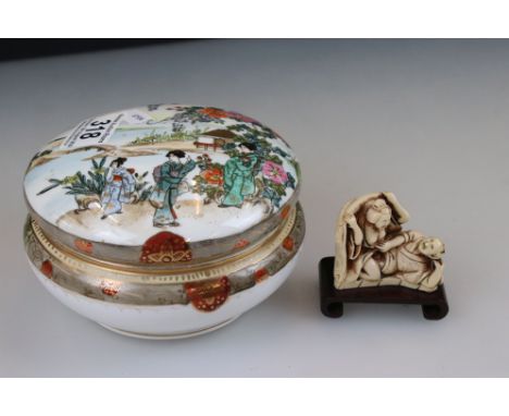 A Noritake lidded ceramic vanity jar together with a resin oriental erotic figure. 