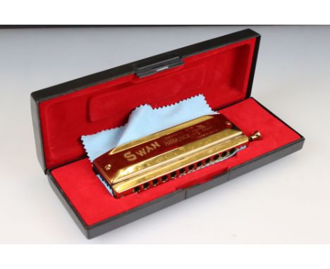 A cased Swan chromatic 1248 harmonica. 