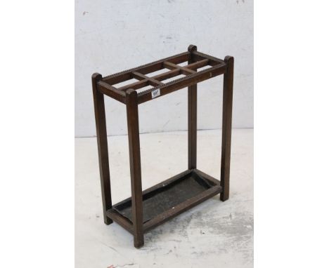 Early 20th century Oak Six Section Stick Stand with metal drip tray, 52cm long x 67cm high 