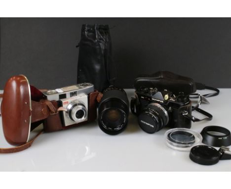An Olympus OM-2 35mm SLR camera with lenses together with a Kodak Colorsnap 35mm camera. 