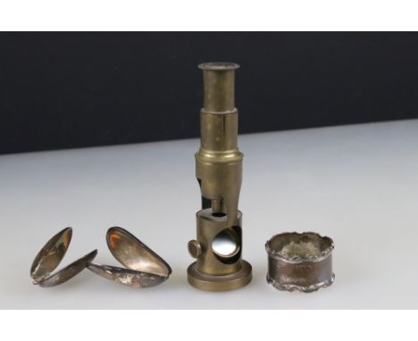 A small group of mixed collectables to include a brass students microscope, a hallmarked silver napkin ring and two silver pl