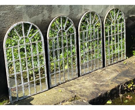 ARCHITECTURAL GARDEN MIRRORS, a set of four, regency style arched metal frames in a weathered finish, 60cm H x 36cm. (4) 