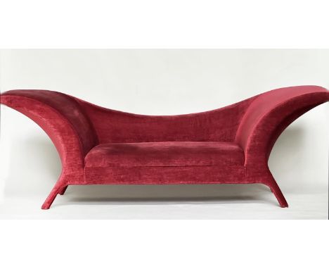 SOFA, Modernist claret red velvet upholstered with outswept arms and swept splay supports, 242cm W. 