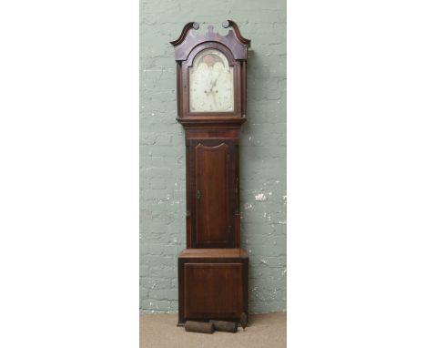 A George III oak and mahogany eight day longcase clock with painted arch top dial incorporating a moon roller, subsidiary sec