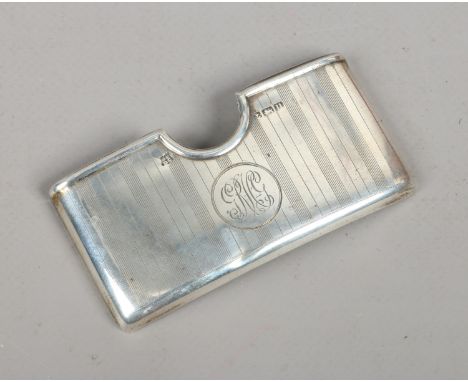 A silver card case with engine turned engraving, assayed Birmingham 1919, 38 grams.