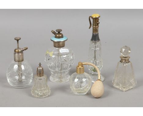 Six scent bottles to include silver and enamel examples.