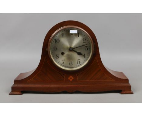 An inlaid walnut mantel clock chiming on a coiled gong.