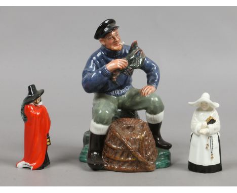A Royal Doulton figure the lobster man, along with a small Royal Doulton figure of Guy Fawkes (AF) and a Royal Worcester cand