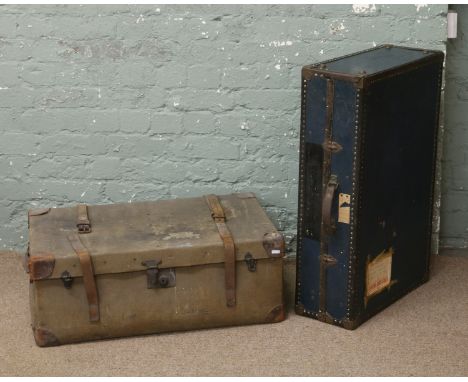 A vintage canvas and leather travel trunk together with a similar metal bound example