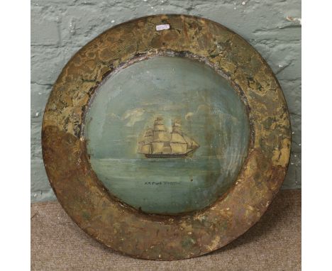A toleware tin roundel wall plaque, painted with H. M. Frigate Vindictive.