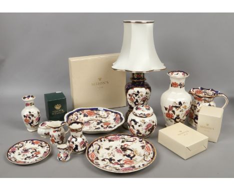 A large collection of Masons Ironstone decorated in the Mandalay pattern, includes a table lamp and shade, vases and some box