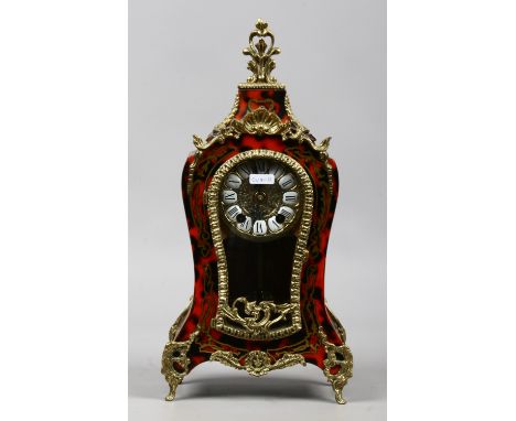 A simulated boulle work and brass mounted eight day mantle clock  hourly chiming on a bell  