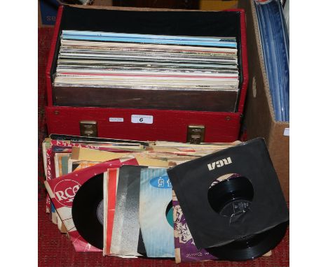 A collection of 45s including picture sleeves and a case of L.P records including Beatles and Rolling Stones compilations.