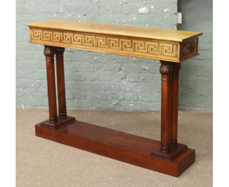 A carved mahogany four pillar console / side table, the frieze carved with blind fret Greek key design 130cm wide 