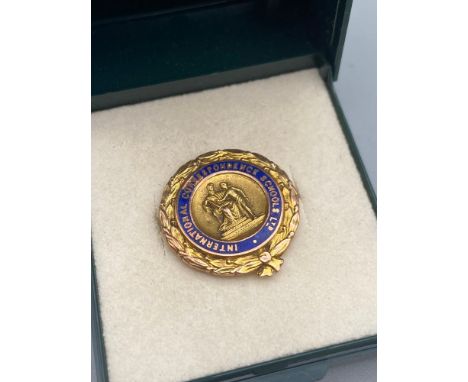 A 9ct gold and blue enamel International Correspondence Schools Ltd fob [2.99 grams]