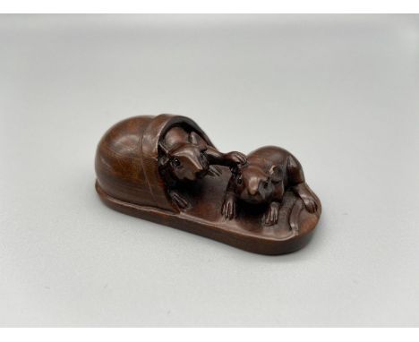 Japanese hand carved netsuke of a pair of mice hiding within a slipper, signed by the artist [6cm length] 