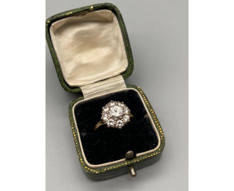 A Beautiful Antique 18ct gold ladies ring set with 1.60ct diamonds. A Large 0.75ct diamond centre surround by eight 0.11ct di