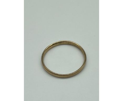 A Gold band ring stamped '333' [Weighs 1.85 grams] [Ring size X] 