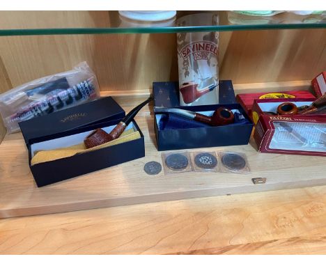 A Shelf of collectable smoking pipes which include makers 'Barling, Falcon &amp; Savinelli all as new with boxes. Together wi