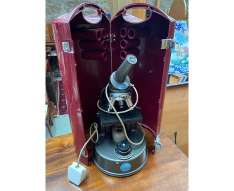 A Vintage C Baker London microscope within a fitted travel case 