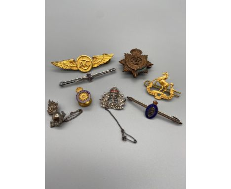 A Collection of Military R.A.F, Naval and army brooches and cap badges, Which includes Silver Royal Artillery Ubique brooch d