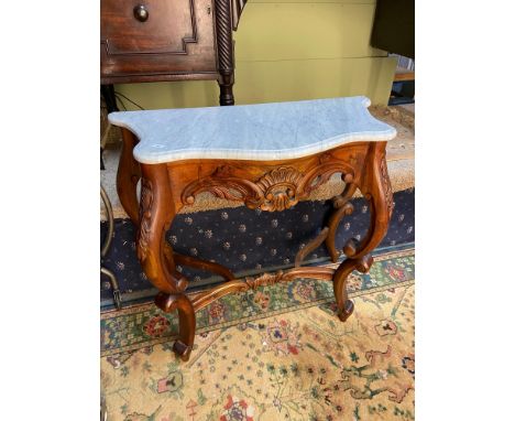 A Reproduction ornate antique style console table, designed with marble top. [73x79x35.5cm] 