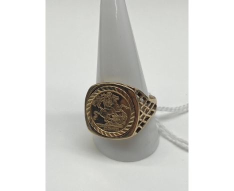 A 9ct gold Gent's St George Medal Ring. [Size W, Weighs 6.42 grams] 