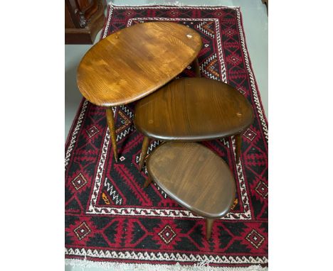 A Vintage set of three Ercol pebble tables. 