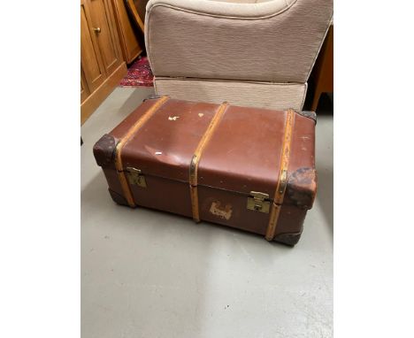 A large vintage wooden bound steamer travel trunk. Showing heavy duty brass locks. Comes with key. 
