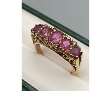 A Ladies Antique 9ct gold ring, set with 5 pink topaz stones &amp; diamond chips [4 grams] 