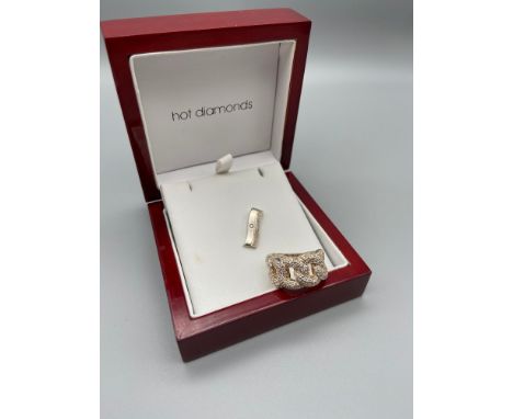 A Silver 925 hot diamonds pendant together with a silver 925 clear stone cluster ring. [Ring size P] 