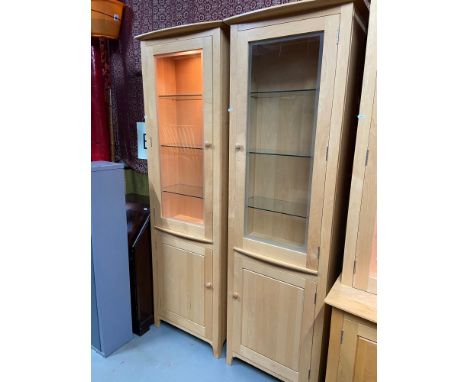 A Pair of contemporary light wood ercol display cabinets. [230x61x30cm] 