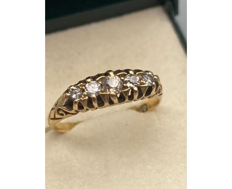 A Victorian 18ct gold ladies ring set with 5 various  sized diamonds. [Ring size N] [2.82 GRAMS] 